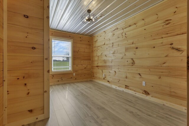 7435 Baltimore Somerset Rd NE, Thornville, OH 43076 - spare room with wooden walls, wood ceiling, and wood finished floors