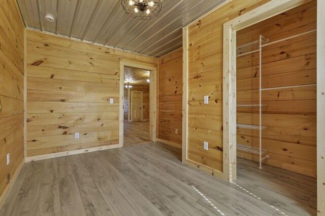 7435 Baltimore Somerset Rd NE, Thornville, OH 43076 - unfurnished room featuring wood walls and wood finished floors