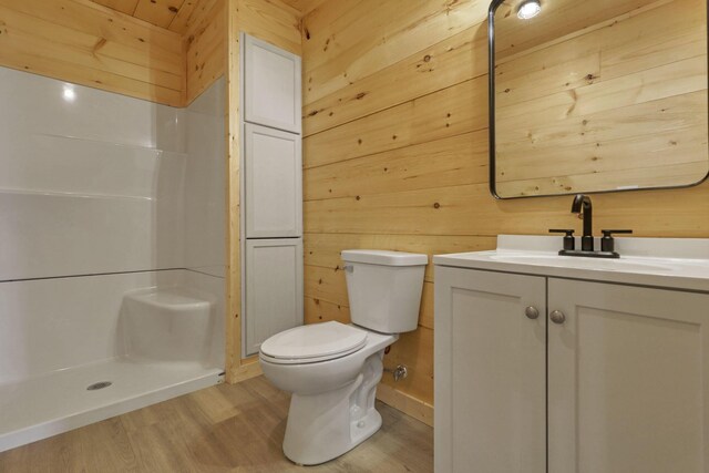 7435 Baltimore Somerset Rd NE, Thornville, OH 43076 - full bath featuring wooden walls, vanity, a shower stall, and wood finished floors