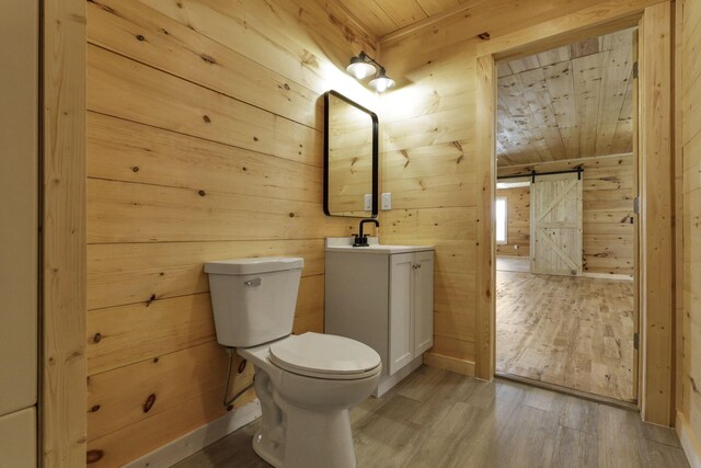 7435 Baltimore Somerset Rd NE, Thornville, OH 43076 - bathroom with vanity, toilet, wood walls, wooden ceiling, and wood finished floors