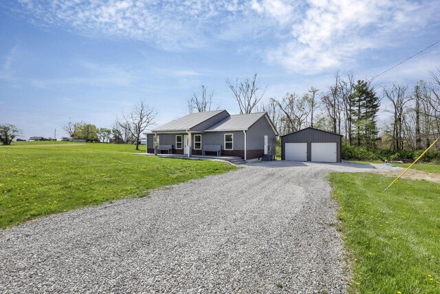 7435 Baltimore Somerset Rd NE, Thornville, OH 43076 - ranch-style house with an outdoor structure, a garage, a front lawn, gravel driveway, and metal roof