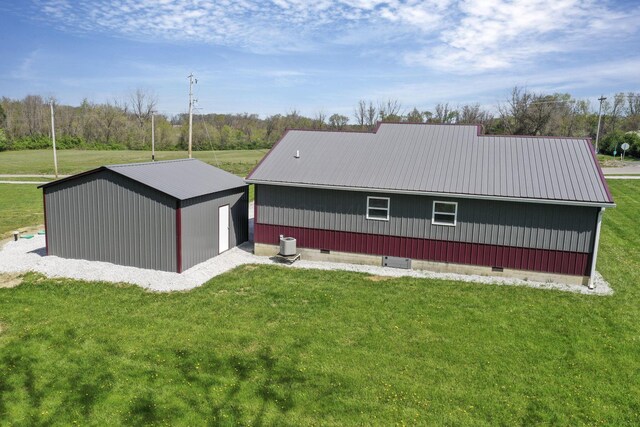 7435 Baltimore Somerset Rd NE, Thornville, OH 43076 - rear view of property with a yard, metal roof, and crawl space