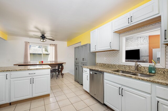kitchen with a sink, dishwasher, a ceiling fan, light tile patterned floors, and backsplash