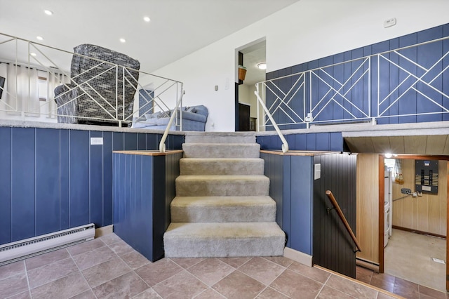 stairs with recessed lighting and baseboard heating