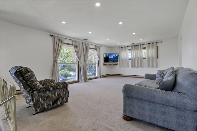 carpeted living room with recessed lighting, baseboard heating, and a baseboard radiator