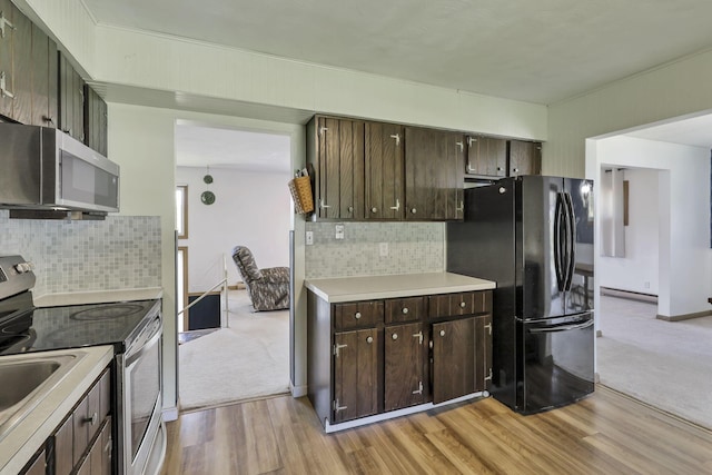 kitchen with stainless steel appliances, dark brown cabinetry, light wood-style flooring, and a baseboard radiator