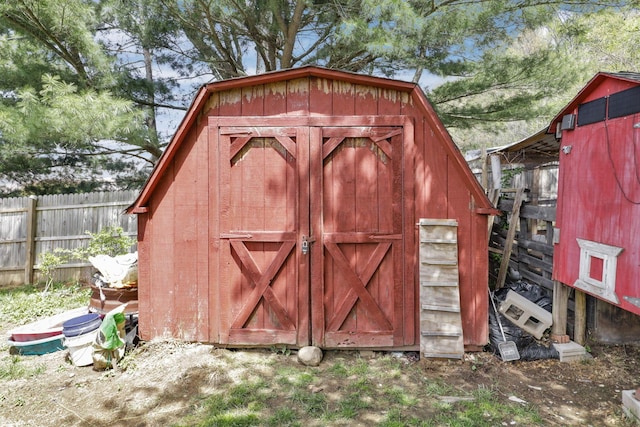 view of shed with fence