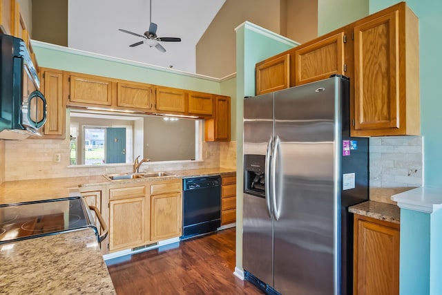 kitchen featuring a sink, black dishwasher, tasteful backsplash, and stainless steel fridge with ice dispenser
