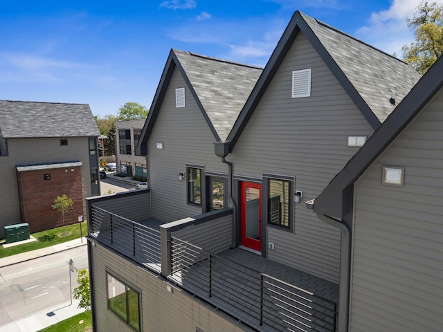rear view of property with a balcony