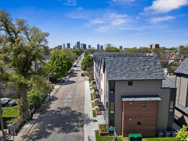 birds eye view of property with a view of city