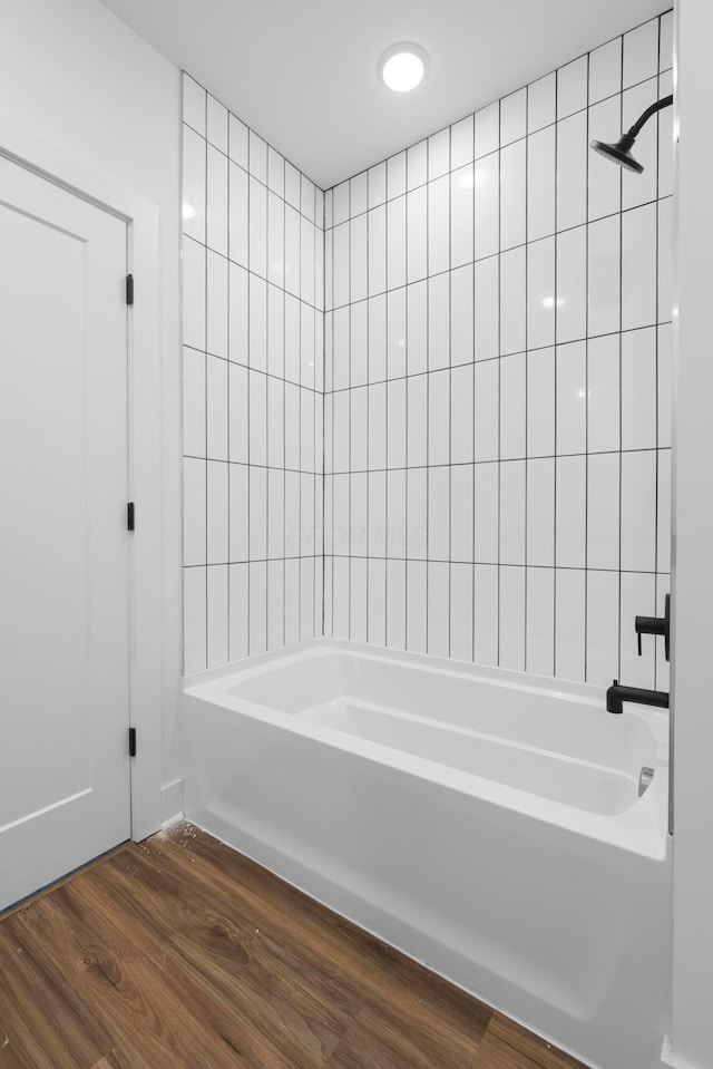 full bathroom with bathtub / shower combination and wood finished floors