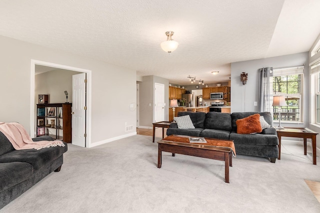 living room featuring baseboards, light carpet, and visible vents