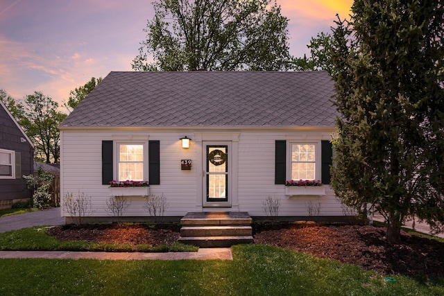439 Chatham Rd, Columbus, OH 43214 - view of front of property with a yard and roof with shingles