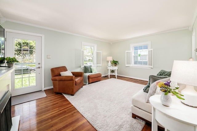 439 Chatham Rd, Columbus, OH 43214 - living area with a healthy amount of sunlight, wood finished floors, baseboards, and ornamental molding