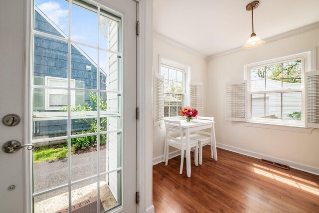 439 Chatham Rd, Columbus, OH 43214 - doorway to outside featuring crown molding, wood-type flooring, baseboards, and visible vents