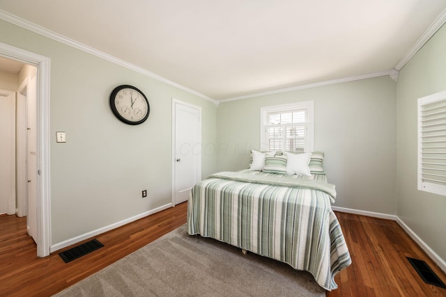 439 Chatham Rd, Columbus, OH 43214 - bedroom with ornamental molding, visible vents, and wood finished floors
