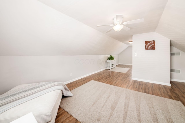 439 Chatham Rd, Columbus, OH 43214 - unfurnished bedroom featuring vaulted ceiling, wood finished floors, visible vents, and baseboards