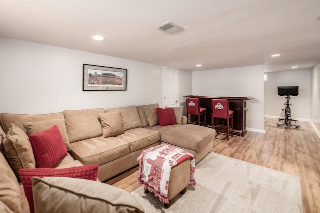 439 Chatham Rd, Columbus, OH 43214 - living area with wood finished floors, a bar, visible vents, baseboards, and recessed lighting