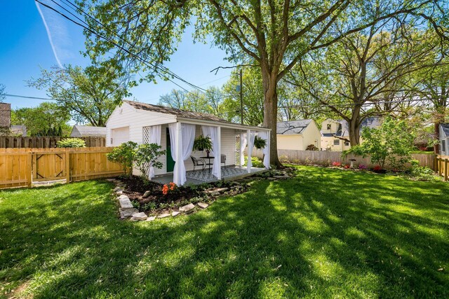 439 Chatham Rd, Columbus, OH 43214 - view of yard with an outdoor structure, a patio, a garage, and a fenced backyard