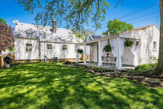439 Chatham Rd, Columbus, OH 43214 - rear view of house with a yard and a chimney