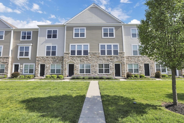 483 Autumn Ridge Cir, Pickerington, OH 43147 - view of property with stone siding and a front lawn