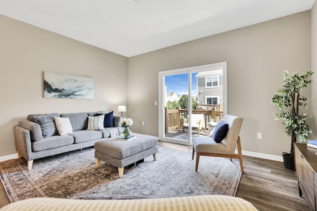 483 Autumn Ridge Cir, Pickerington, OH 43147 - living room featuring dark wood-style flooring and baseboards