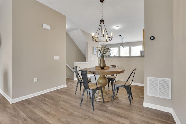 483 Autumn Ridge Cir, Pickerington, OH 43147 - dining space featuring a chandelier, baseboards, and wood finished floors
