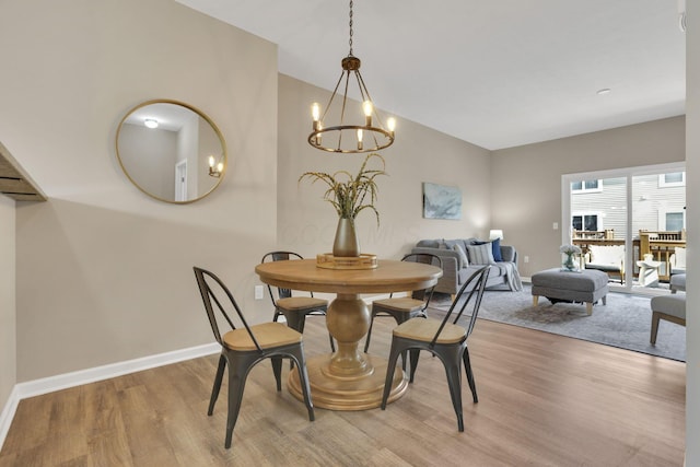 483 Autumn Ridge Cir, Pickerington, OH 43147 - dining room featuring light wood-style flooring, a chandelier, and baseboards