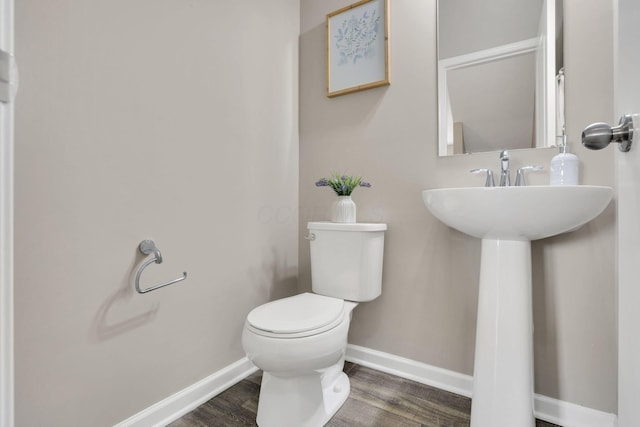 483 Autumn Ridge Cir, Pickerington, OH 43147 - bathroom with baseboards, toilet, wood finished floors, and a sink