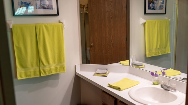 bathroom with vanity and walk in shower