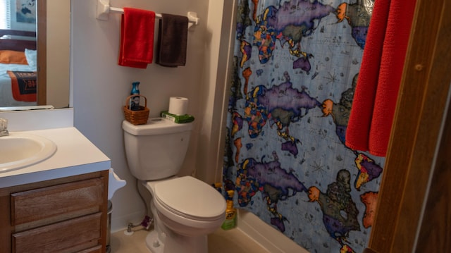 bathroom with vanity, curtained shower, and toilet