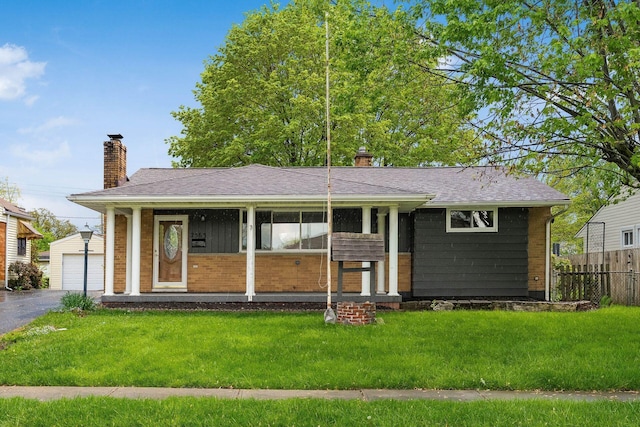 2583 Kingston Ave, Grove City, OH 43123 - ranch-style home featuring fence, a chimney, a front yard, and an outbuilding