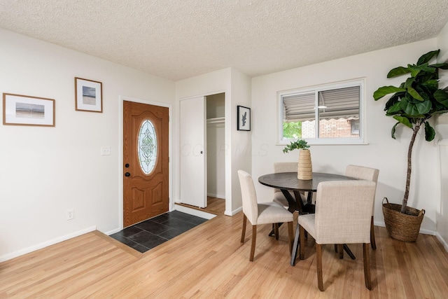 2583 Kingston Ave, Grove City, OH 43123 - entryway with baseboards, a textured ceiling, and wood finished floors