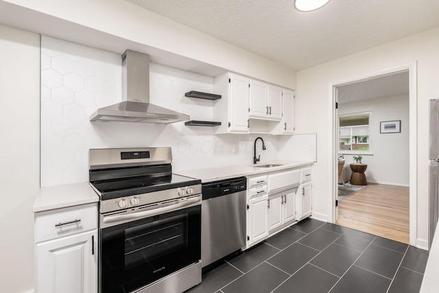 2583 Kingston Ave, Grove City, OH 43123 - kitchen with wall chimney range hood, stainless steel appliances, decorative backsplash, and a sink