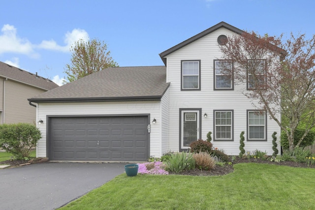 347 Wyncroft Ct, Pataskala, OH 43062 - traditional-style house with an attached garage, driveway, a shingled roof, and a front yard