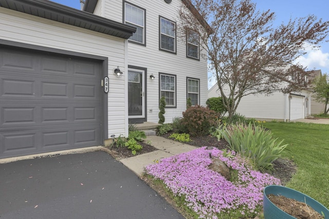 347 Wyncroft Ct, Pataskala, OH 43062 - exterior space with a yard, a garage, and aphalt driveway