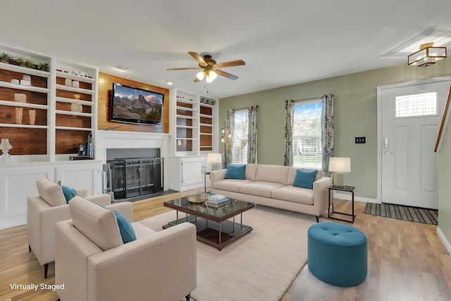 347 Wyncroft Ct, Pataskala, OH 43062 - living room featuring ceiling fan, wood finished floors, and built in shelves