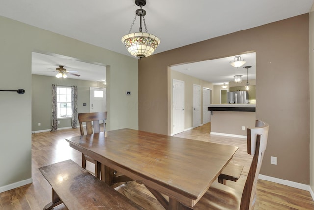 347 Wyncroft Ct, Pataskala, OH 43062 - dining area featuring baseboards, ceiling fan, and light wood-type flooring