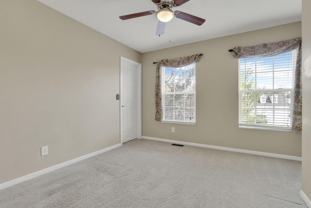347 Wyncroft Ct, Pataskala, OH 43062 - carpeted empty room featuring baseboards, visible vents, a healthy amount of sunlight, and ceiling fan