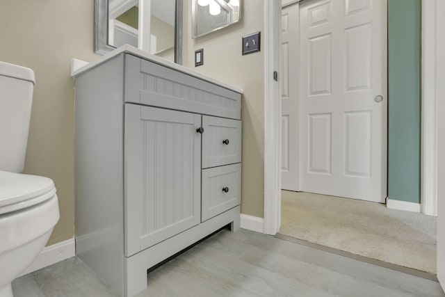 347 Wyncroft Ct, Pataskala, OH 43062 - bathroom with baseboards, wood finished floors, and toilet