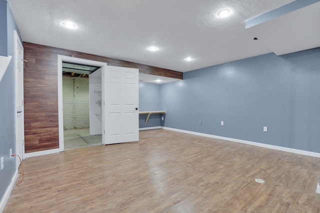 347 Wyncroft Ct, Pataskala, OH 43062 - finished below grade area featuring baseboards, recessed lighting, light wood finished floors, and a textured ceiling