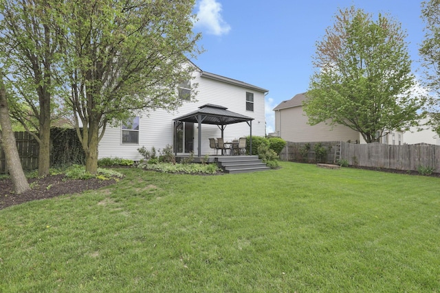 347 Wyncroft Ct, Pataskala, OH 43062 - back of house with a gazebo, a fenced backyard, a lawn, and a wooden deck