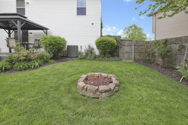 347 Wyncroft Ct, Pataskala, OH 43062 - view of yard with fence, central AC unit, a gazebo, and a fire pit
