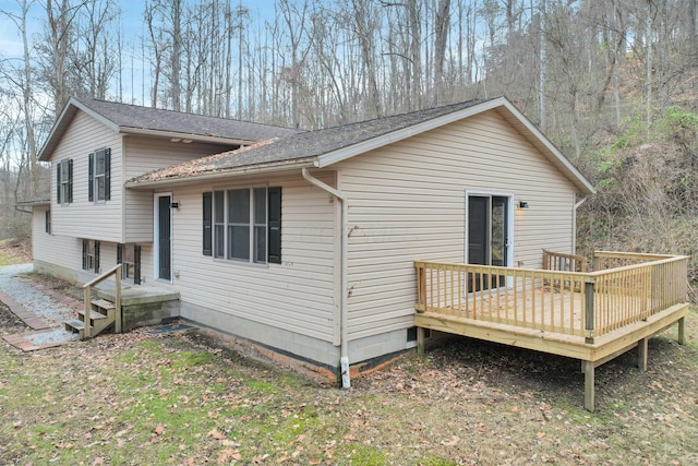 1889 Wolverine Dr, Sugar Grove, OH 43155 - view of property exterior with a deck and roof with shingles