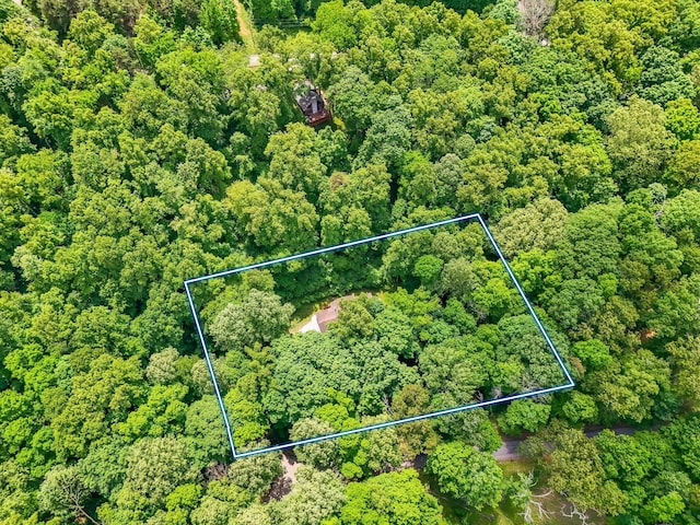 1889 Wolverine Dr, Sugar Grove, OH 43155 - aerial view of property and surrounding area featuring property parcel outlined and a heavily wooded area