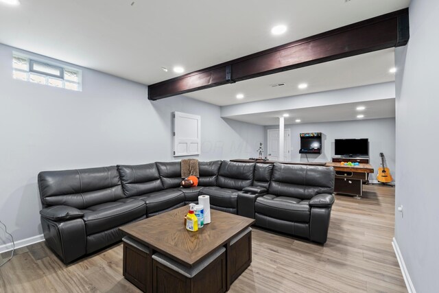 living room featuring light wood-style floors, recessed lighting, and baseboards
