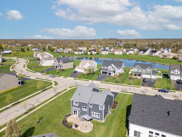 birds eye view of property with a residential view and a water view