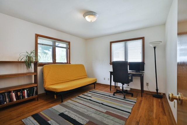 office area with wood finished floors and a healthy amount of sunlight