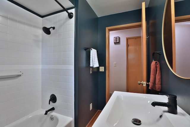 bathroom featuring a sink and bathtub / shower combination