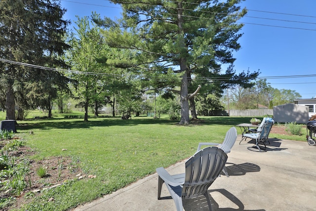 view of yard with a patio and fence
